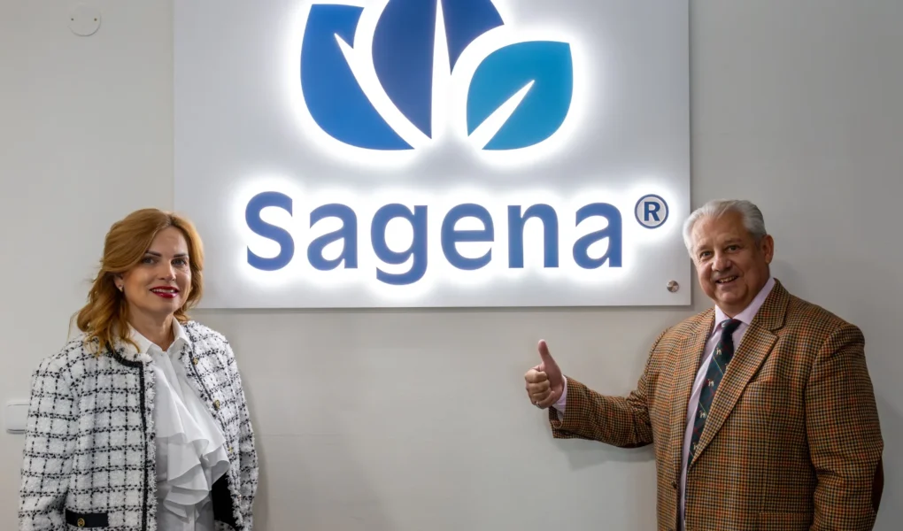 Mr and Mrs Kubíček, company representatives of SAGENA, pictured in front of the SAGENA logo.