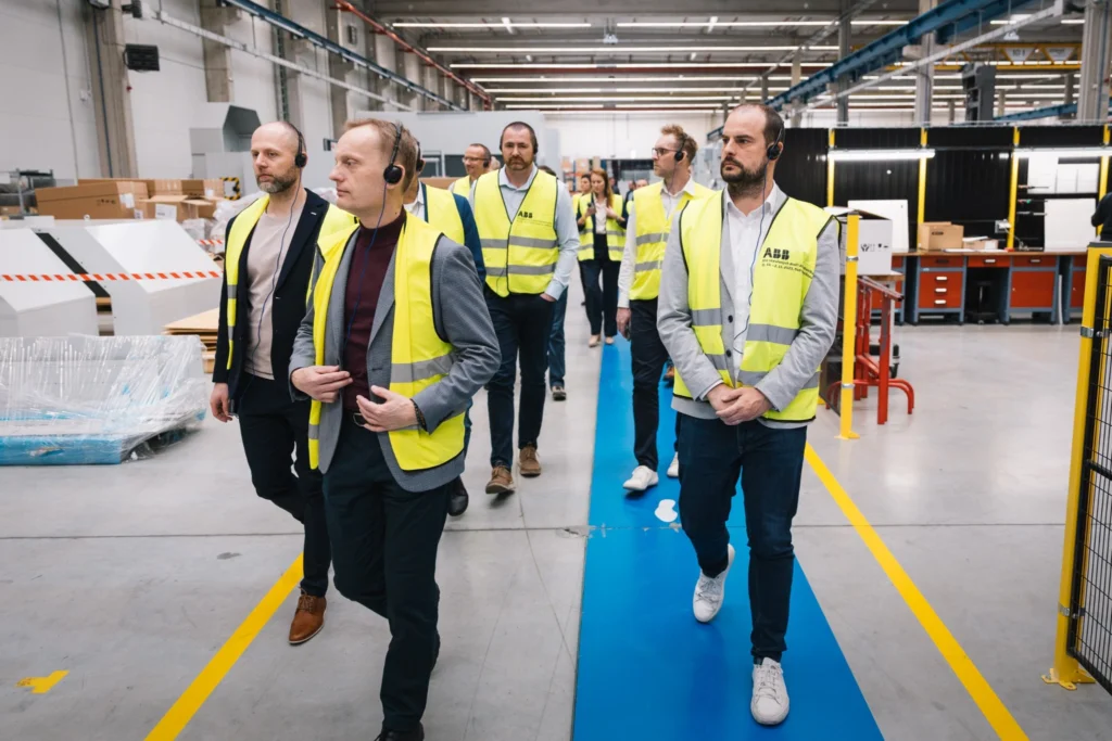 Participants in the Leaders Talk walk through the highly robotised ABB Robotics Czech Republic facility during a guided tour in Mošnov.